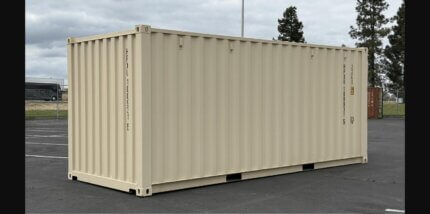Brand new 20ft beige shipping container side view in storage yard - Cargo Co Pty Ltd